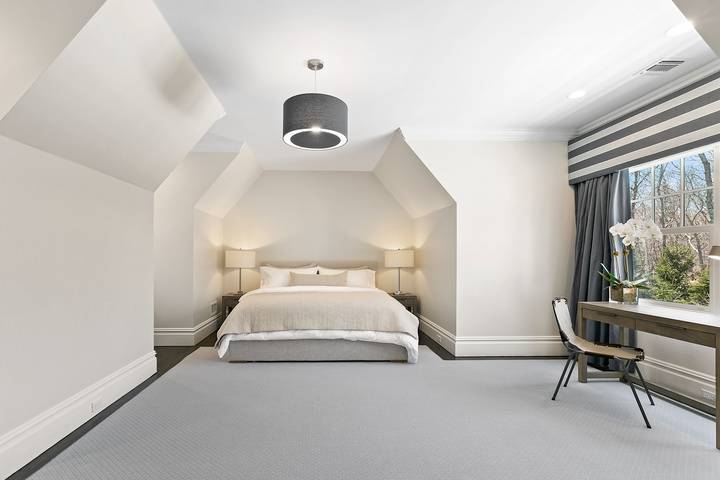 496 Wainscott Harbor Road Sagaponack, NY 11962 - Photo 15 of 20 a bedroom with a bed and a large window