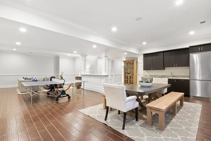 496 Wainscott Harbor Road Sagaponack, NY 11962 - Photo 17 of 20 a living room with dining room and kitchen view with wooden floor