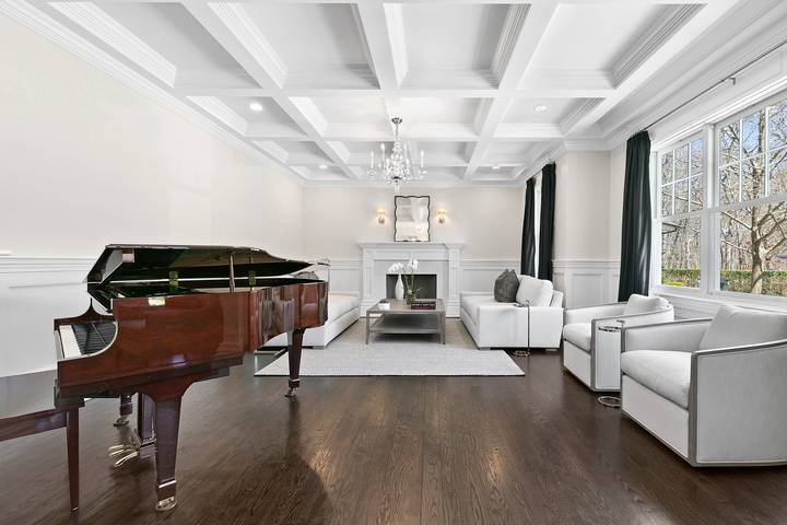 496 Wainscott Harbor Road Sagaponack, NY 11962 - Photo 4 of 20 a living room with furniture and a fireplace