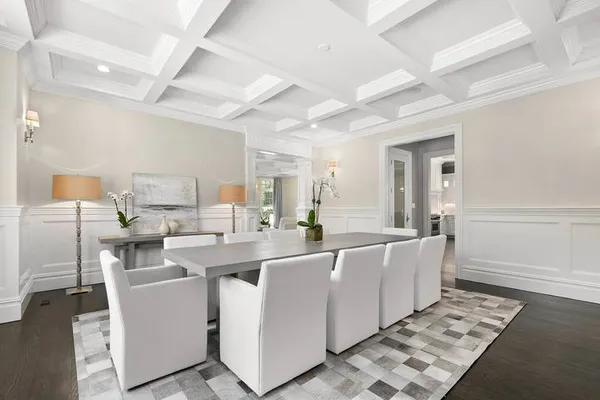 a large white kitchen with a large window