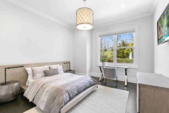 496 Wainscott Harbor Road Sagaponack, NY 11962 - Photo 10 of 20 a bedroom with a bed and a window