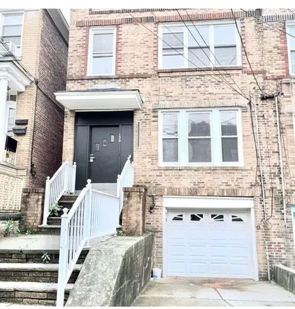 a front view of a building with glass windows
