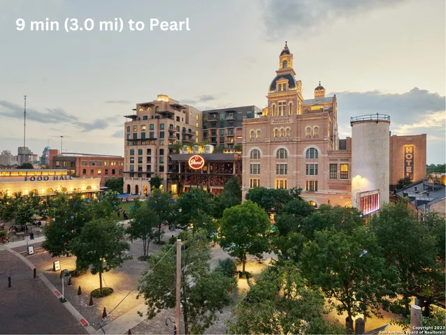 an outdoor space with seating area and sign board