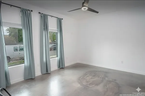 an empty room with windows