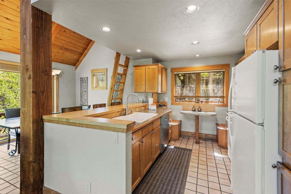 12 Big Boulder Court, Unit 13 Keystone, CO 80435 - Photo 11 of 35 a kitchen with sink cabinets and refrigerator