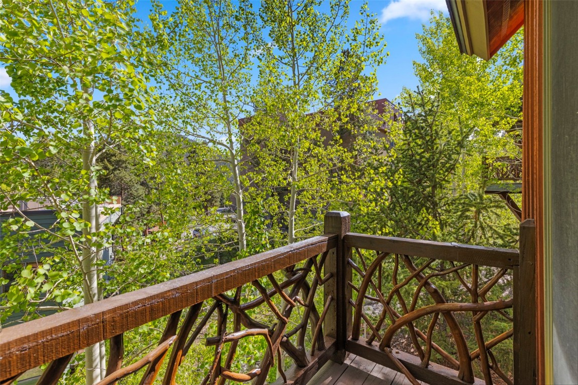 12 Big Boulder Court, Unit 13 Keystone, CO 80435 - Photo 18 of 35 a view of a balcony with wooden fence