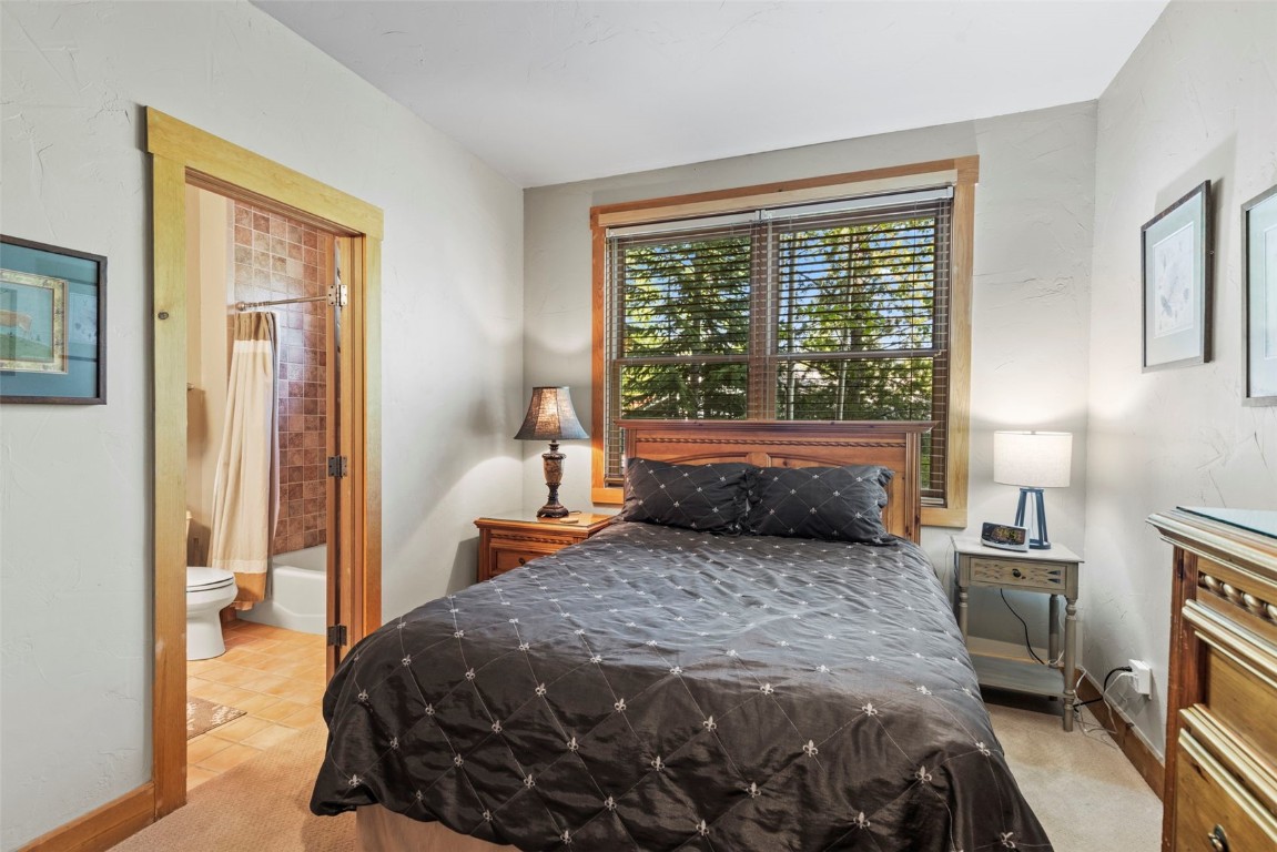 12 Big Boulder Court, Unit 13 Keystone, CO 80435 - Photo 31 of 35 a bedroom with a bed and a window