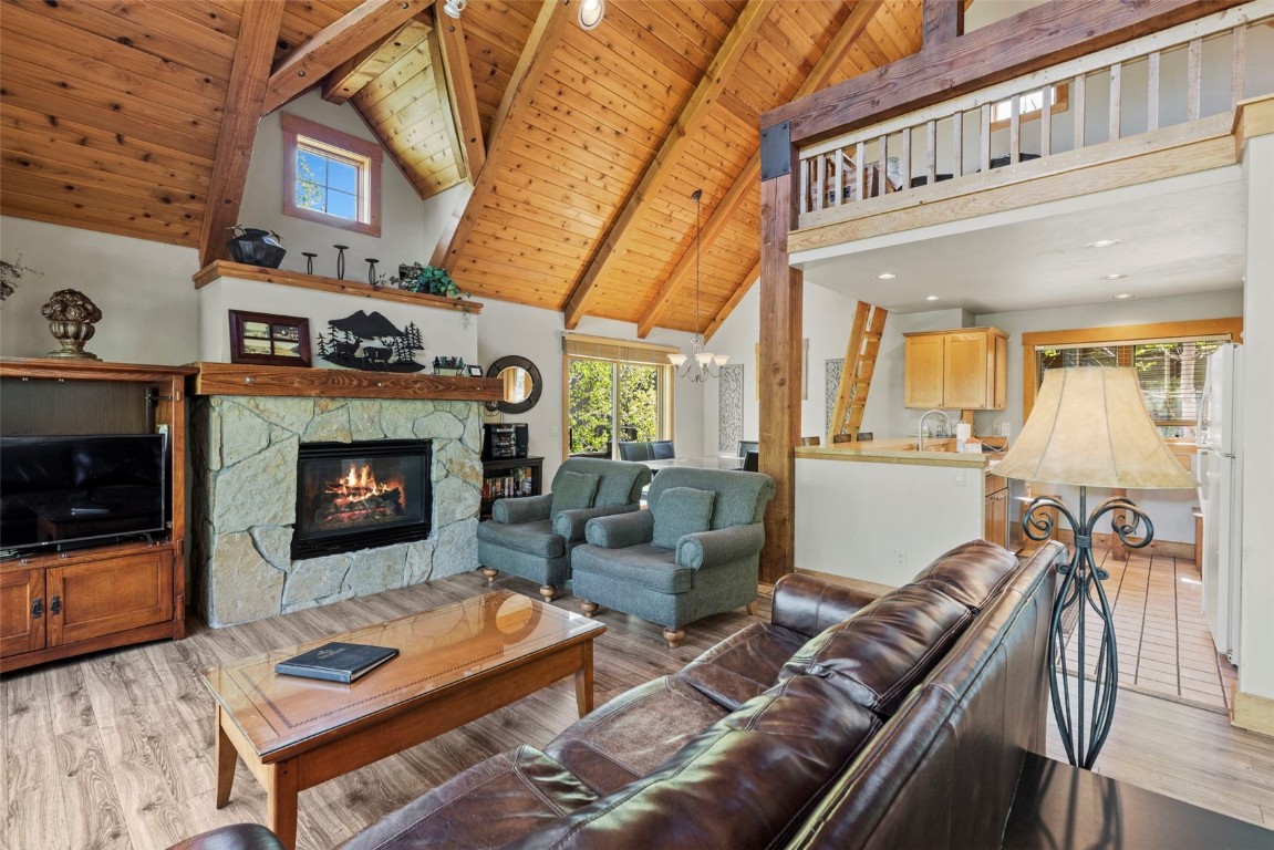 12 Big Boulder Court, Unit 13 Keystone, CO 80435 - Photo 4 of 35 a living room with furniture and a fireplace