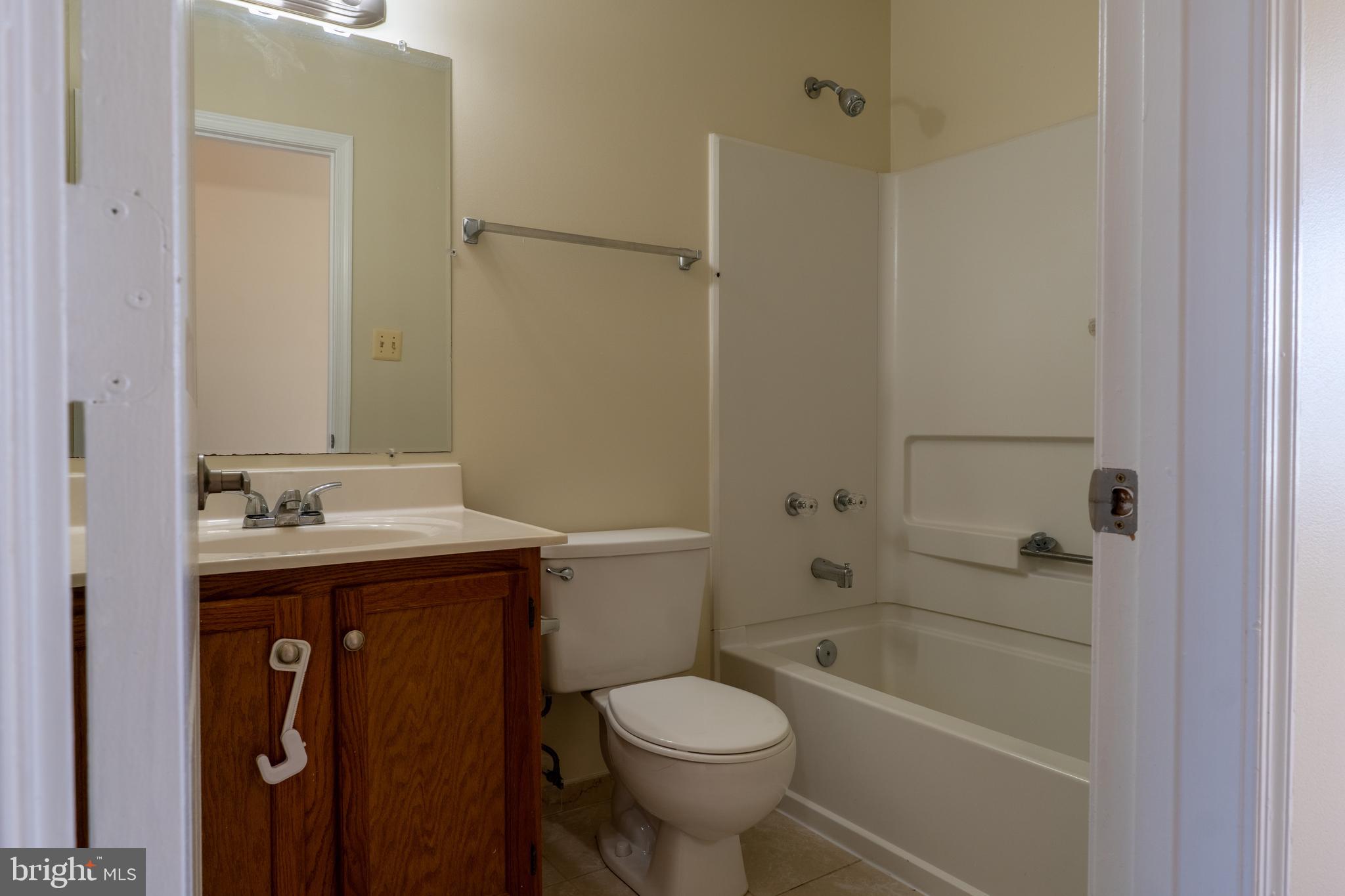 224 Oak Leaf Way Halethorpe, MD 21227 - Photo 19 of 32 a bathroom with a sink toilet and shower