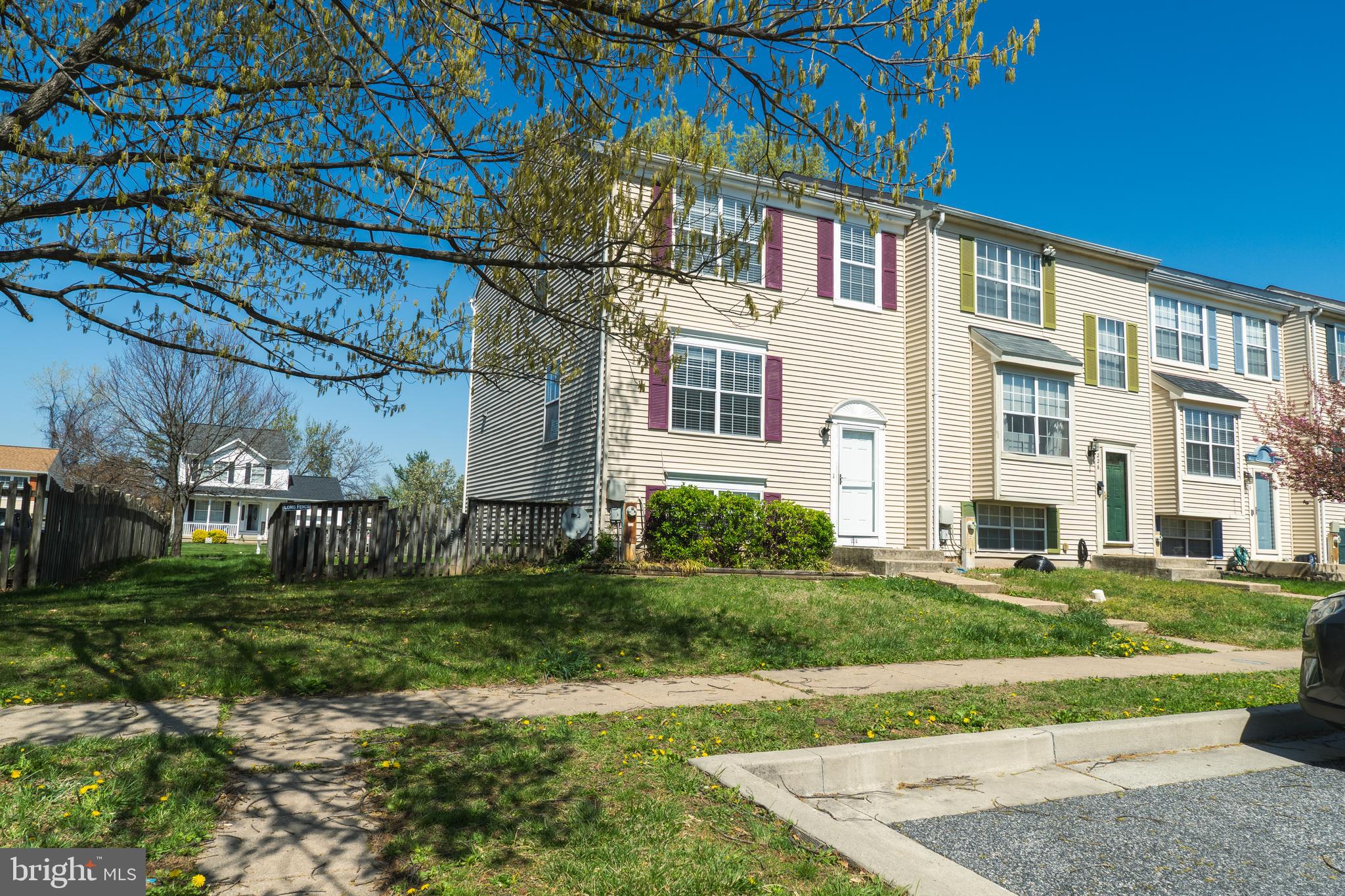 224 Oak Leaf Way Halethorpe, MD 21227 - Photo 2 of 32 a view of a building with a yard