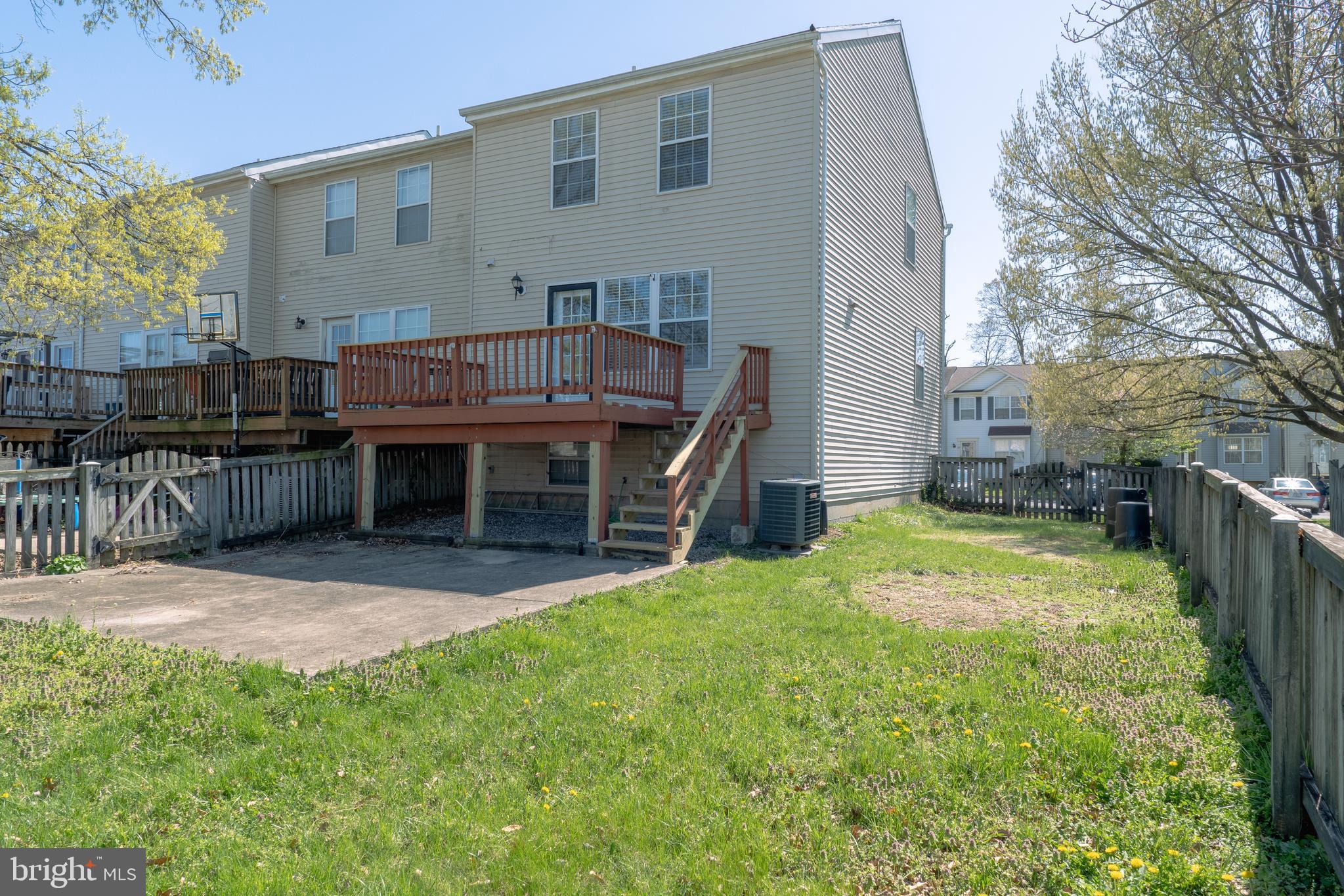 224 Oak Leaf Way Halethorpe, MD 21227 - Photo 31 of 32 a backyard of a house with table and chairs