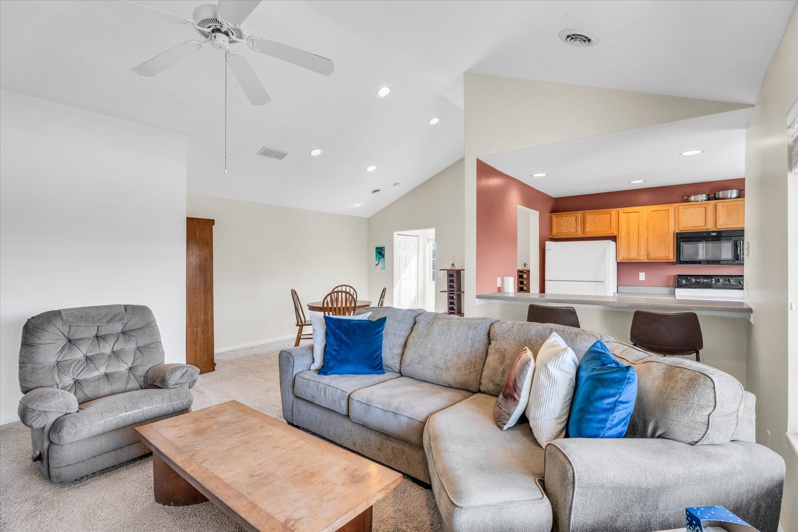 2402 Windward Boulevard, Unit 210 Champaign, IL 61821 - Photo 14 of 28 a living room with furniture and a large window
