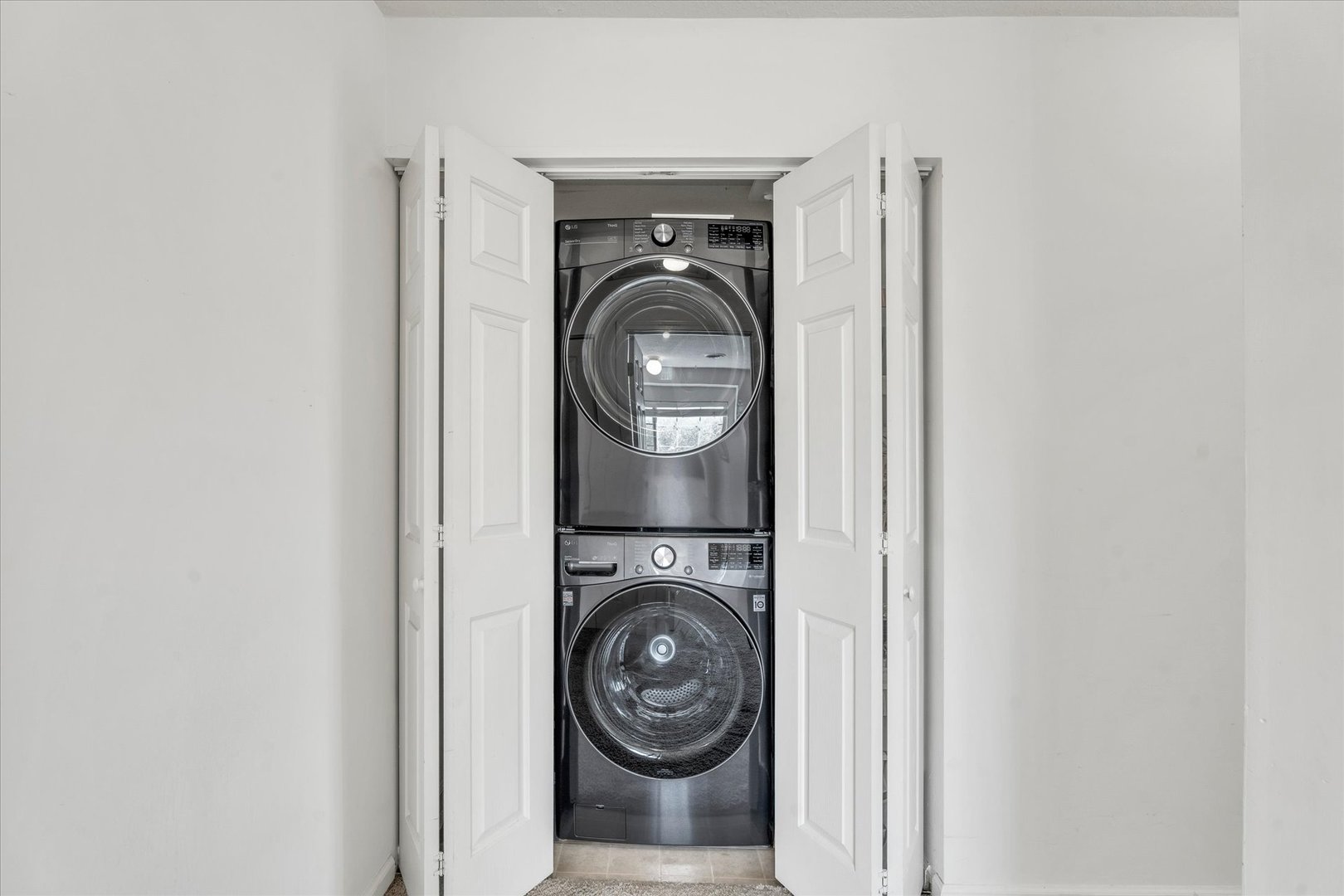 2402 Windward Boulevard, Unit 210 Champaign, IL 61821 - Photo 16 of 28 a view of washer and dryer in a utility room