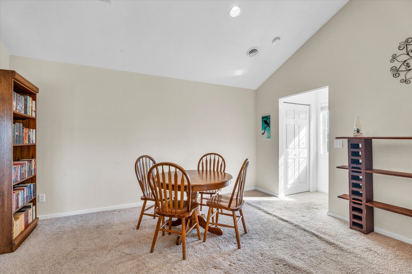 2402 Windward Boulevard, Unit 210 Champaign, IL 61821 - Photo 5 of 28 a dining room with furniture and wooden floor