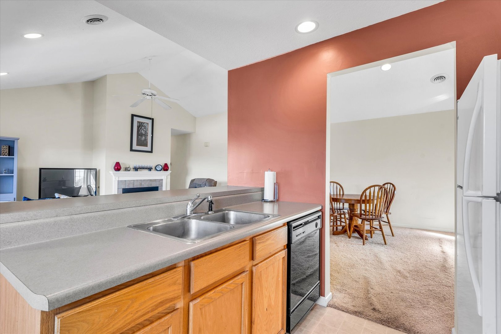 2402 Windward Boulevard, Unit 210 Champaign, IL 61821 - Photo 7 of 28 a kitchen with a sink cabinets and chair