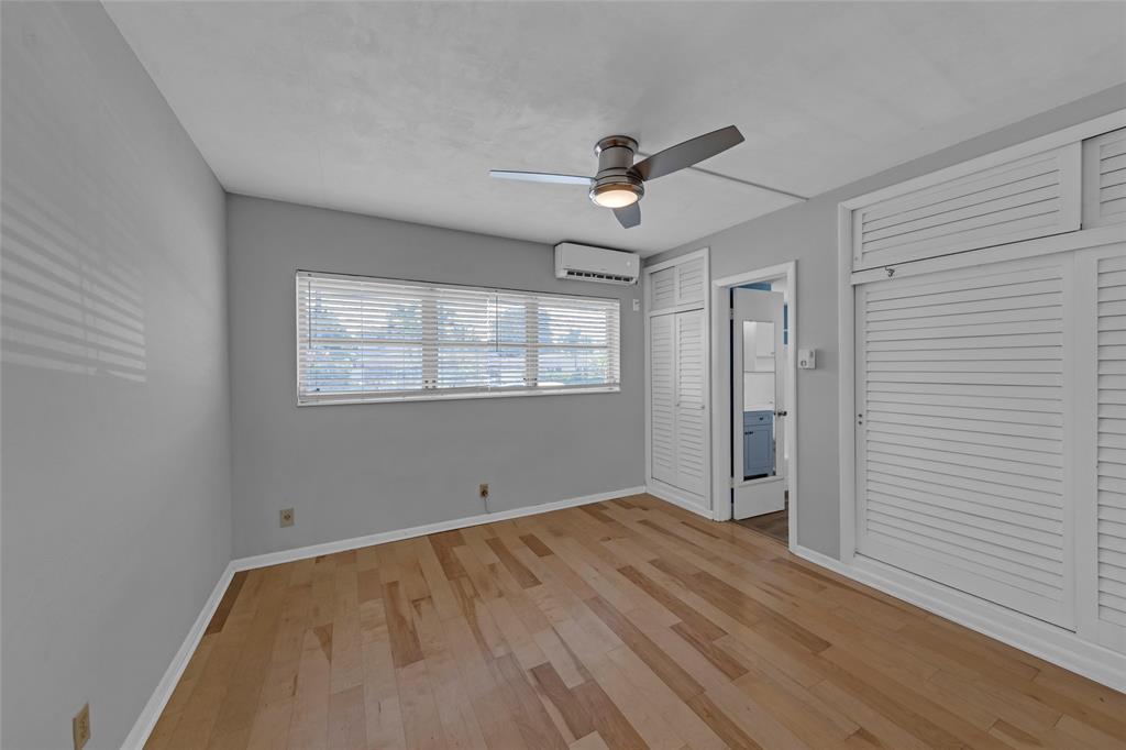 11 Southwest 4th Avenue, Unit 29 Boca Raton, FL 33432 - Photo 23 of 45 a view of empty room with wooden floor and fan