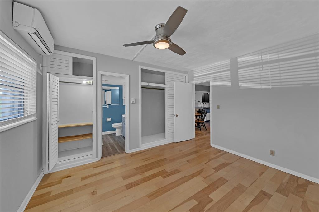 11 Southwest 4th Avenue, Unit 29 Boca Raton, FL 33432 - Photo 25 of 45 a view of empty room with wooden floor and ceiling fan