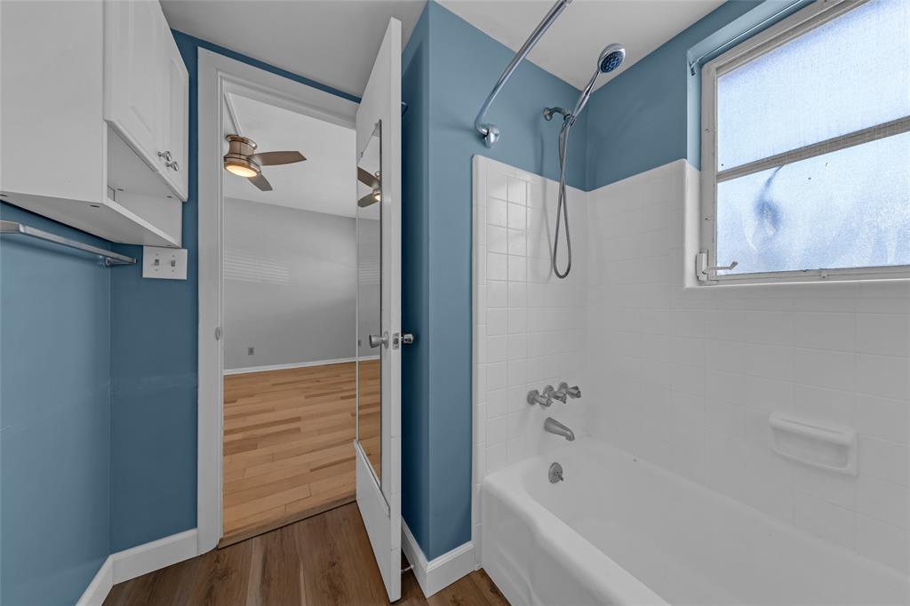 11 Southwest 4th Avenue, Unit 29 Boca Raton, FL 33432 - Photo 29 of 45 a bathroom with a bathtub and a shower