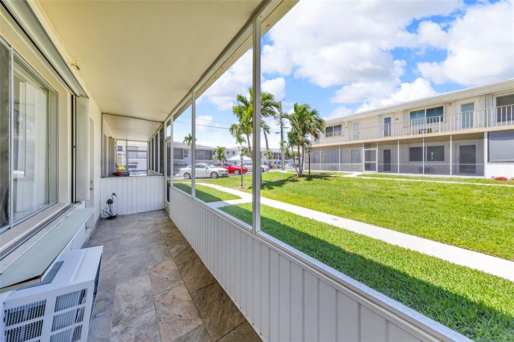11 Southwest 4th Avenue, Unit 29 Boca Raton, FL 33432 - Photo 32 of 45 a view of an house with backyard and swimming pool