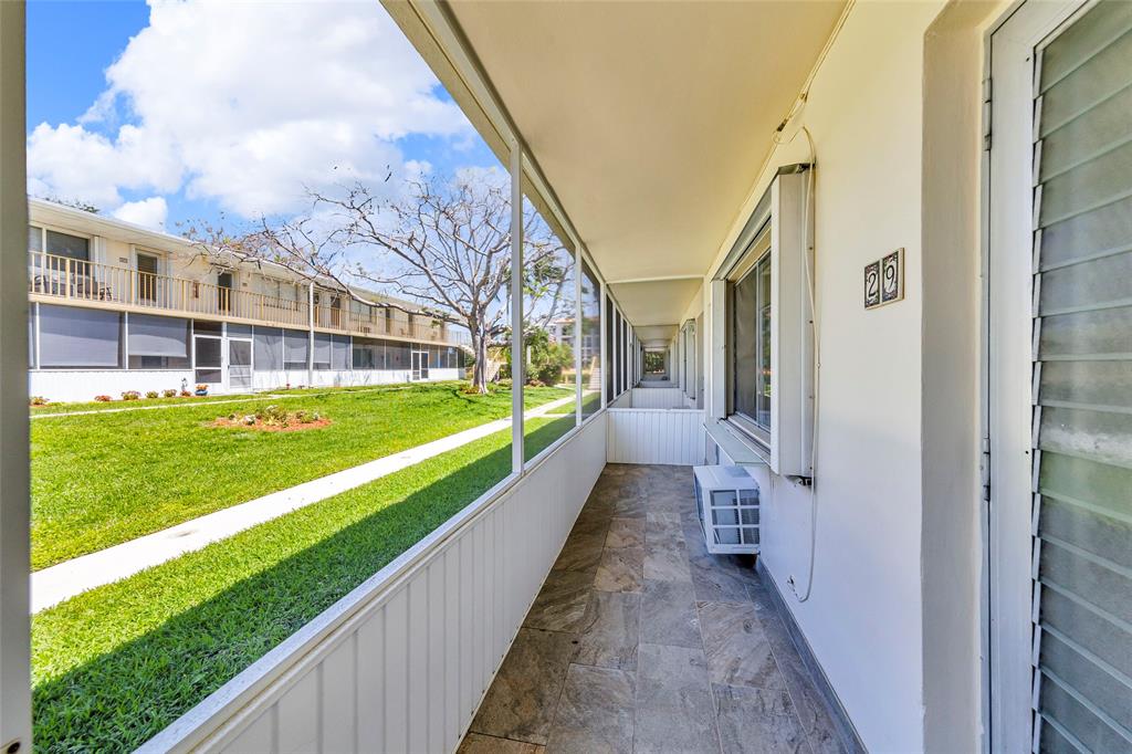 11 Southwest 4th Avenue, Unit 29 Boca Raton, FL 33432 - Photo 33 of 45 a view of a house with a yard