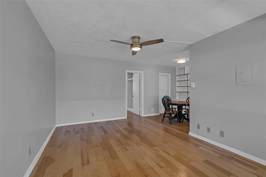 11 Southwest 4th Avenue, Unit 29 Boca Raton, FL 33432 - Photo 4 of 45 an empty room with wooden floor and windows
