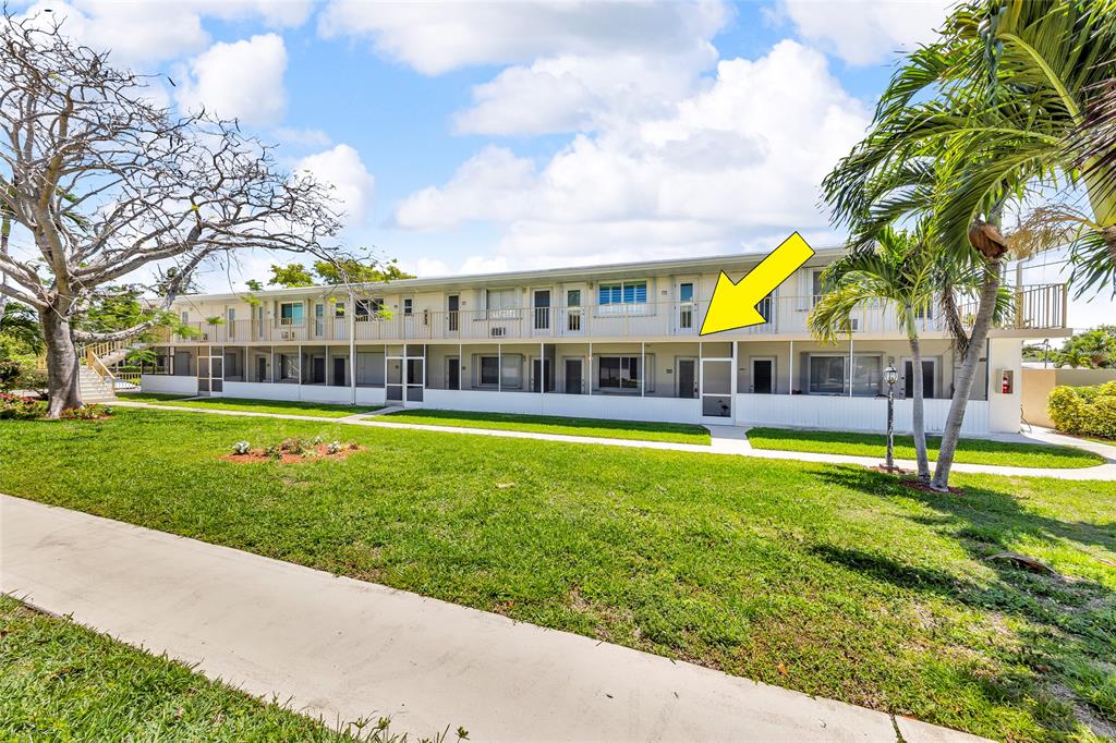 11 Southwest 4th Avenue, Unit 29 Boca Raton, FL 33432 - Photo 42 of 45 a view of a house with a swimming pool and a big yard