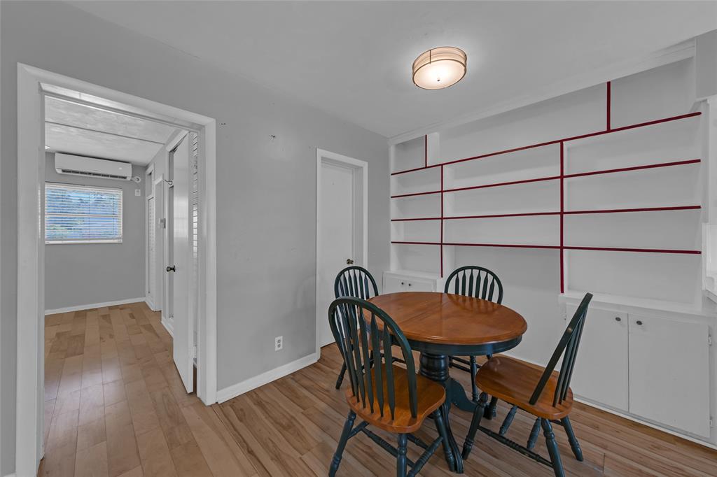 11 Southwest 4th Avenue, Unit 29 Boca Raton, FL 33432 - Photo 7 of 45 a view of a dining room with furniture and wooden floor