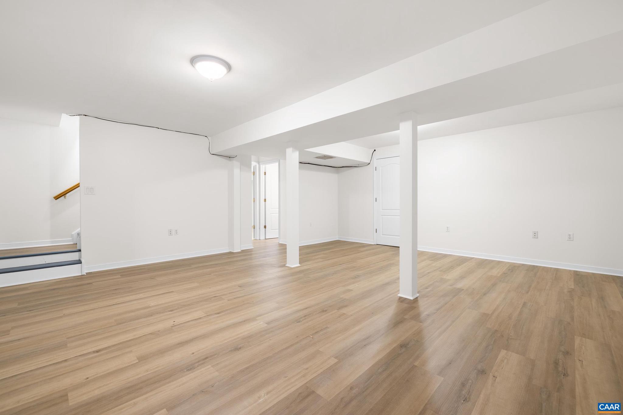 1075 Social Hall Road New Canton, VA 23123 - Photo 15 of 64 an empty room with wooden floor and windows