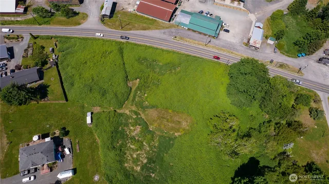 an aerial view of a houses with yard