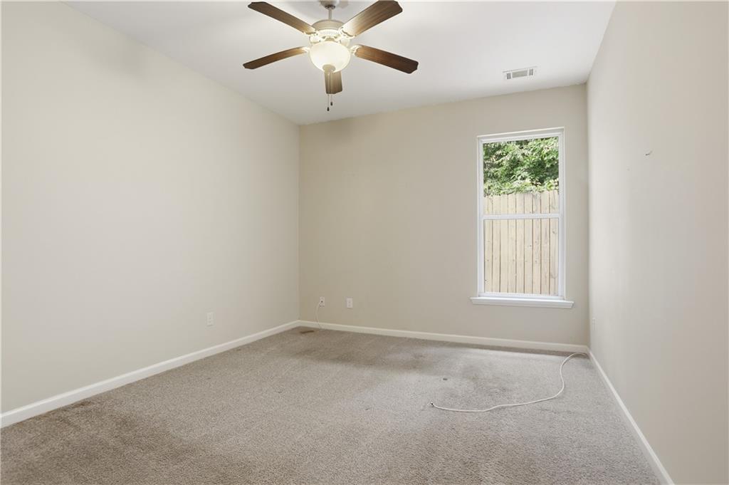 236 Manous Way Canton, GA 30115 - Photo 15 of 25 an empty room with a window and a fan