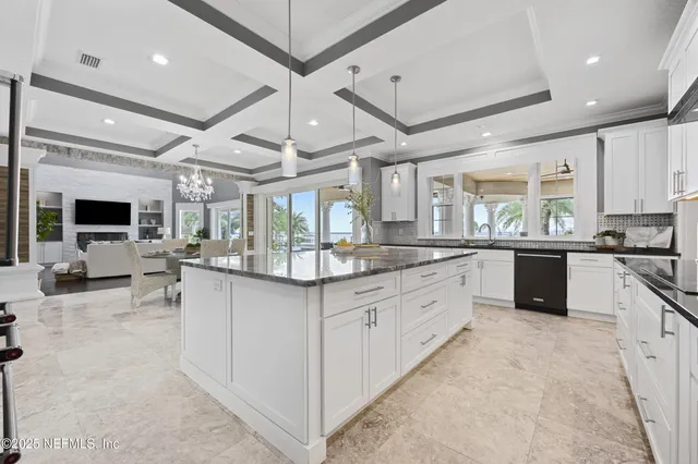 a front view of a house with a yard swimming pool and green space