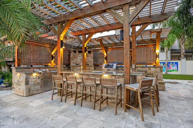 a view of a dinning table and chairs in the patio