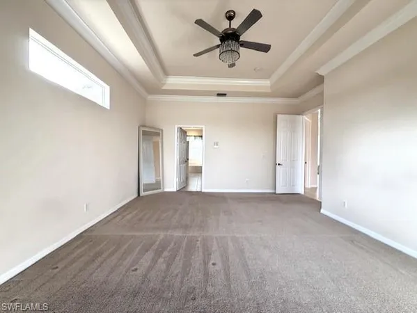 a large kitchen with a stove a sink a microwave and a refrigerator