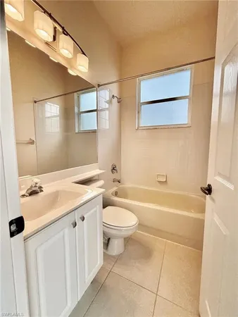 a bedroom with a bed and a cabinets