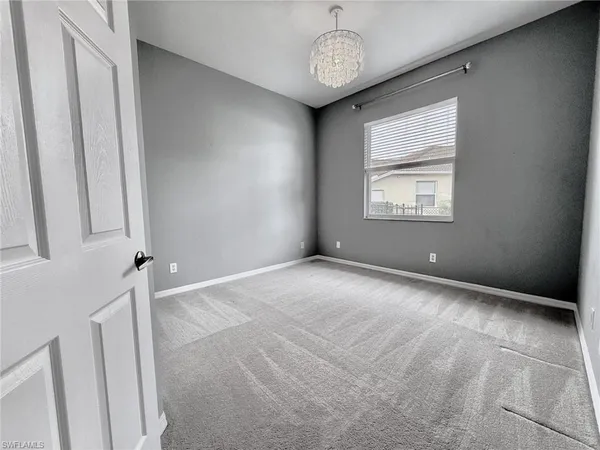 a room with a sink cabinets and utility room