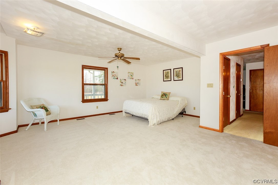 619 Spring Grove Road Spring Grove, VA 23881 - Photo 11 of 45 a spacious bedroom with a bed and a window