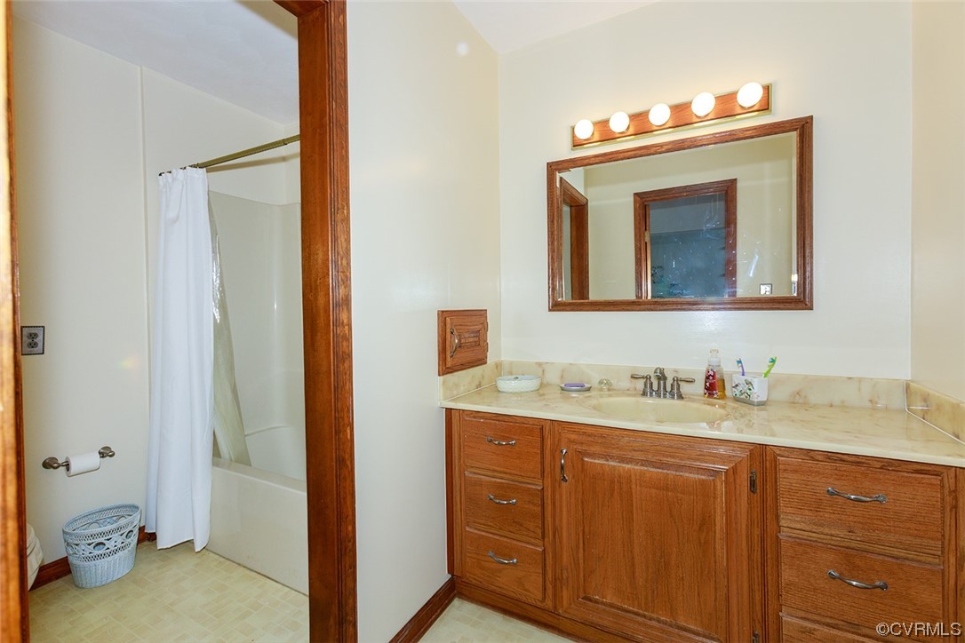 619 Spring Grove Road Spring Grove, VA 23881 - Photo 13 of 45 a bathroom with a sink a toilet and a mirror
