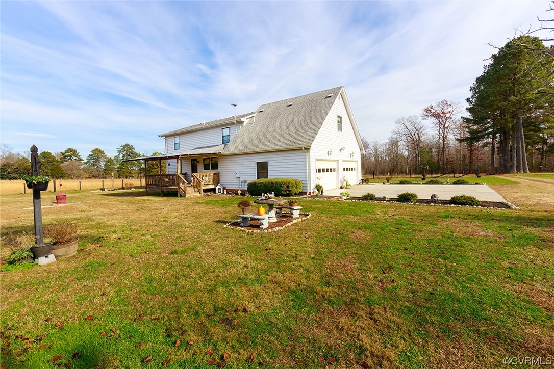 619 Spring Grove Road Spring Grove, VA 23881 - Photo 20 of 45 a swimming pool with outdoor seating and yard