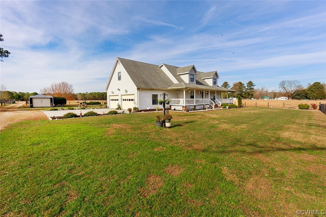 619 Spring Grove Road Spring Grove, VA 23881 - Photo 4 of 45 a view of a house with a big yard and potted plants