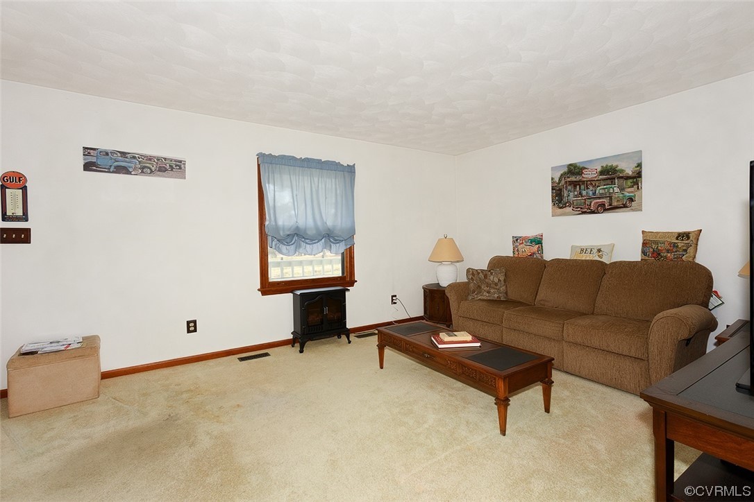 619 Spring Grove Road Spring Grove, VA 23881 - Photo 6 of 45 a living room with furniture and a window