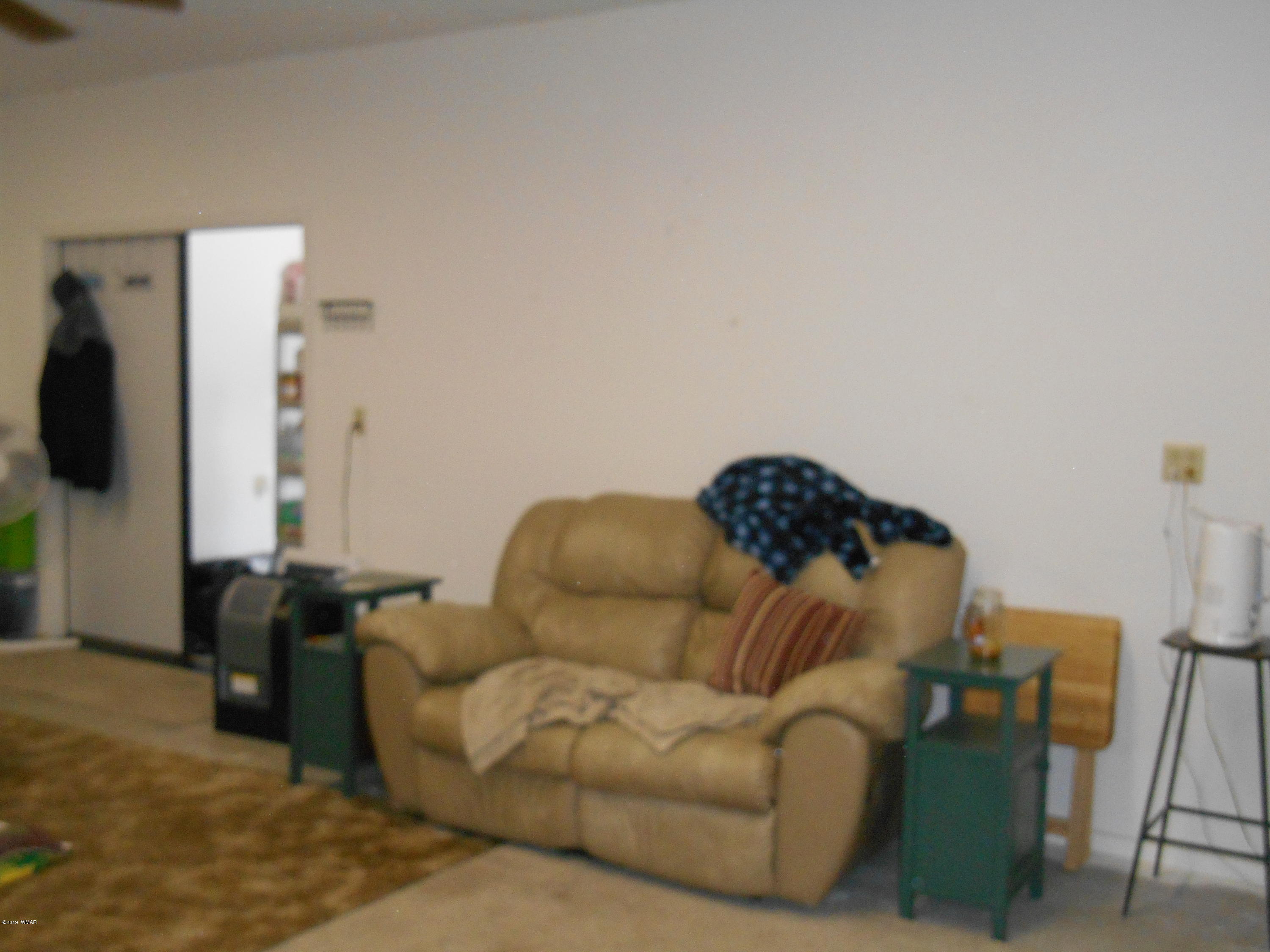 1985 Chevelon Road Heber, AZ 85928 - Photo 10 of 11 a living room with furniture and a flat screen tv