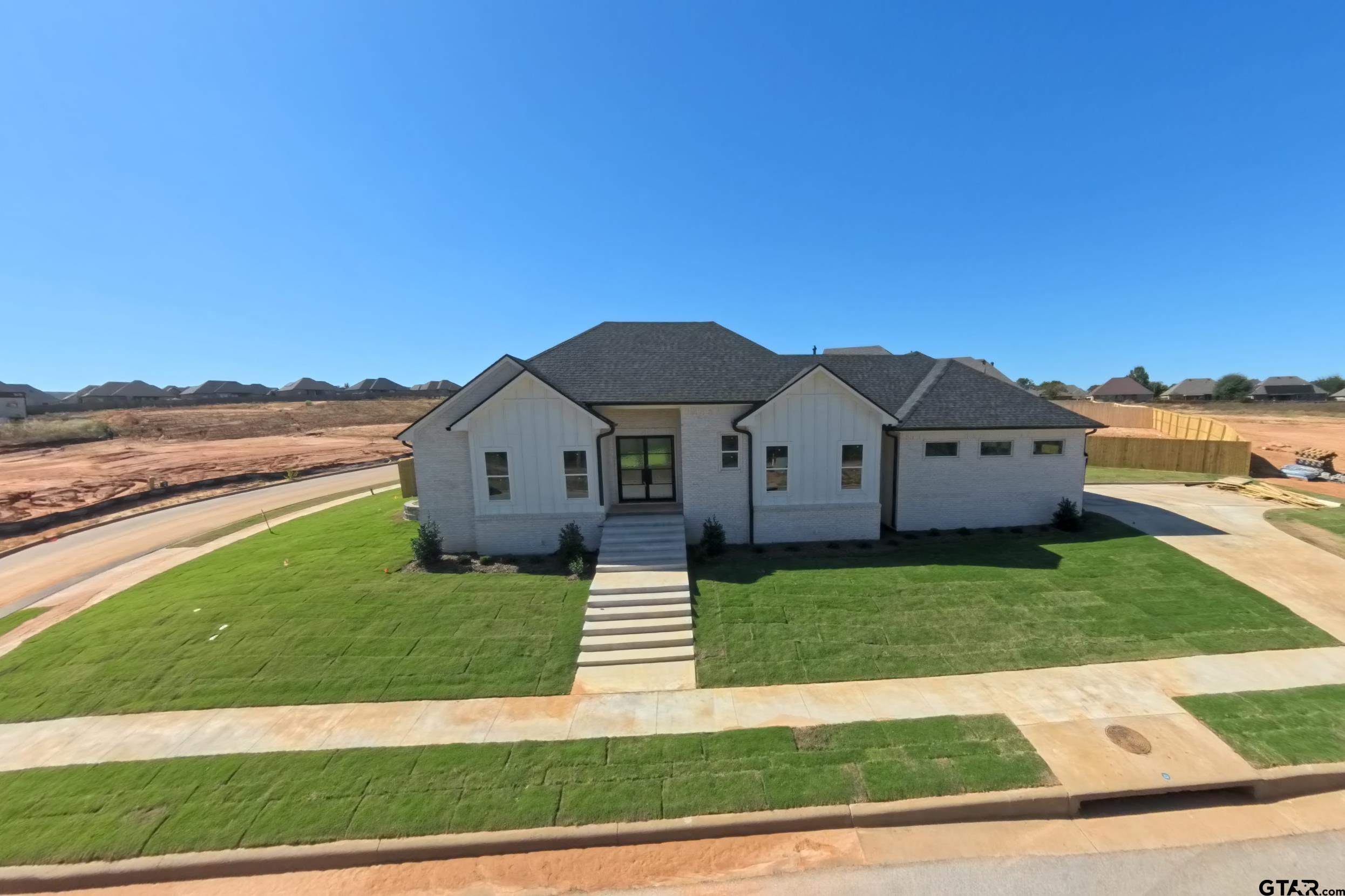 a house view with a garden space