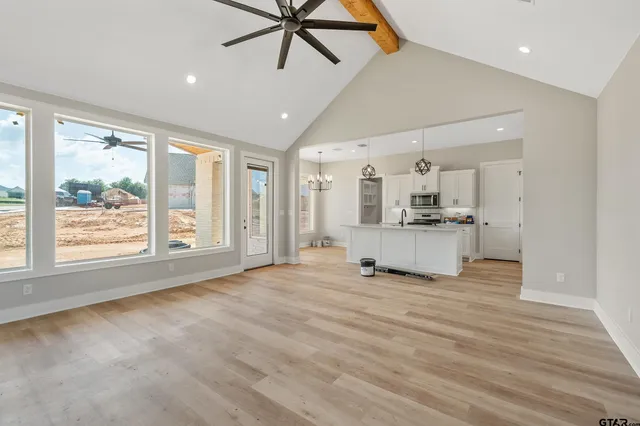 a view of a kitchen with a sink and a window