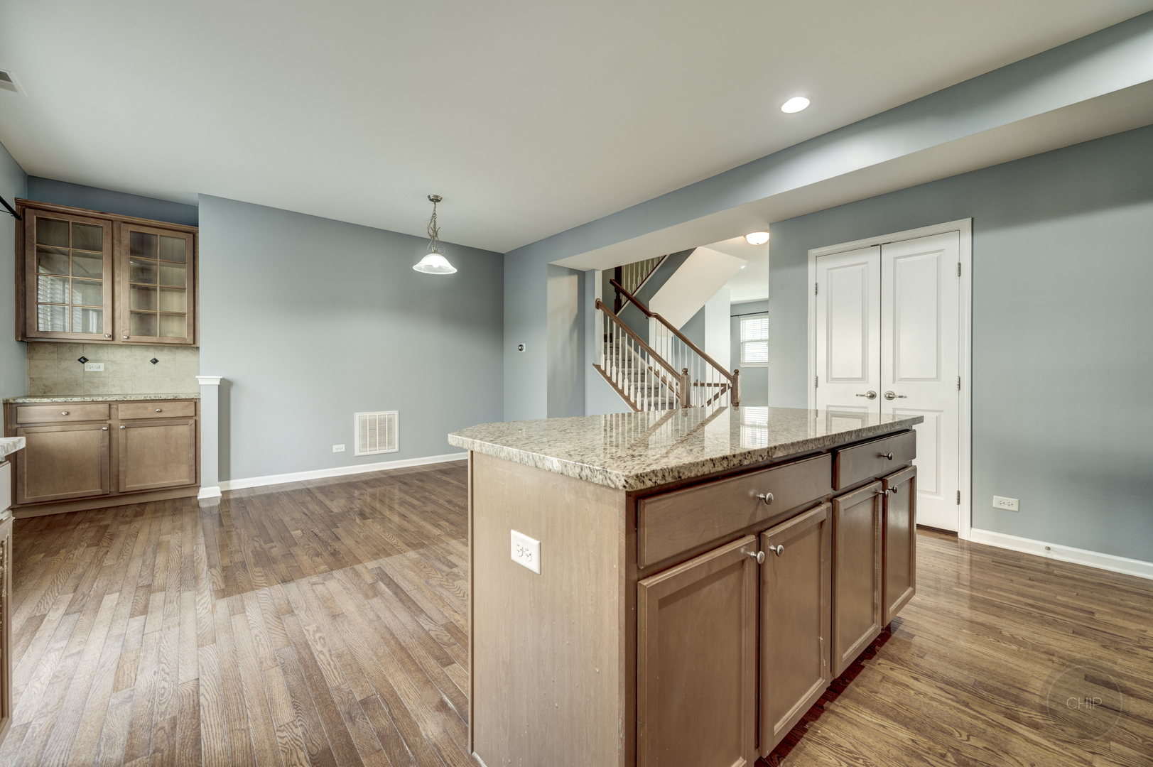 331 North Commerce Street Aurora, IL 60504 - Photo 14 of 41 a kitchen with kitchen island a sink and wooden floors