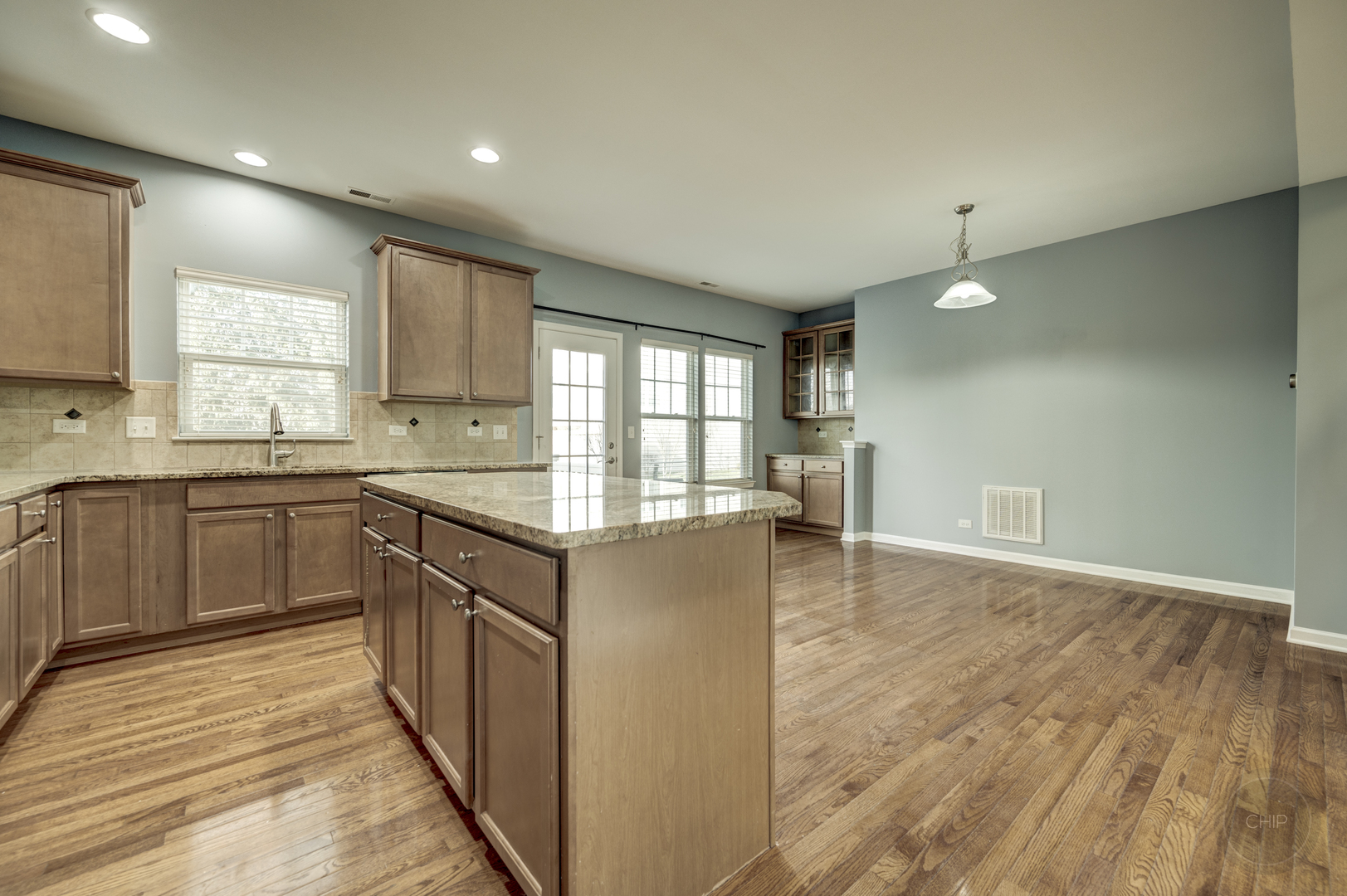 331 North Commerce Street Aurora, IL 60504 - Photo 15 of 41 a kitchen with a sink window and cabinets