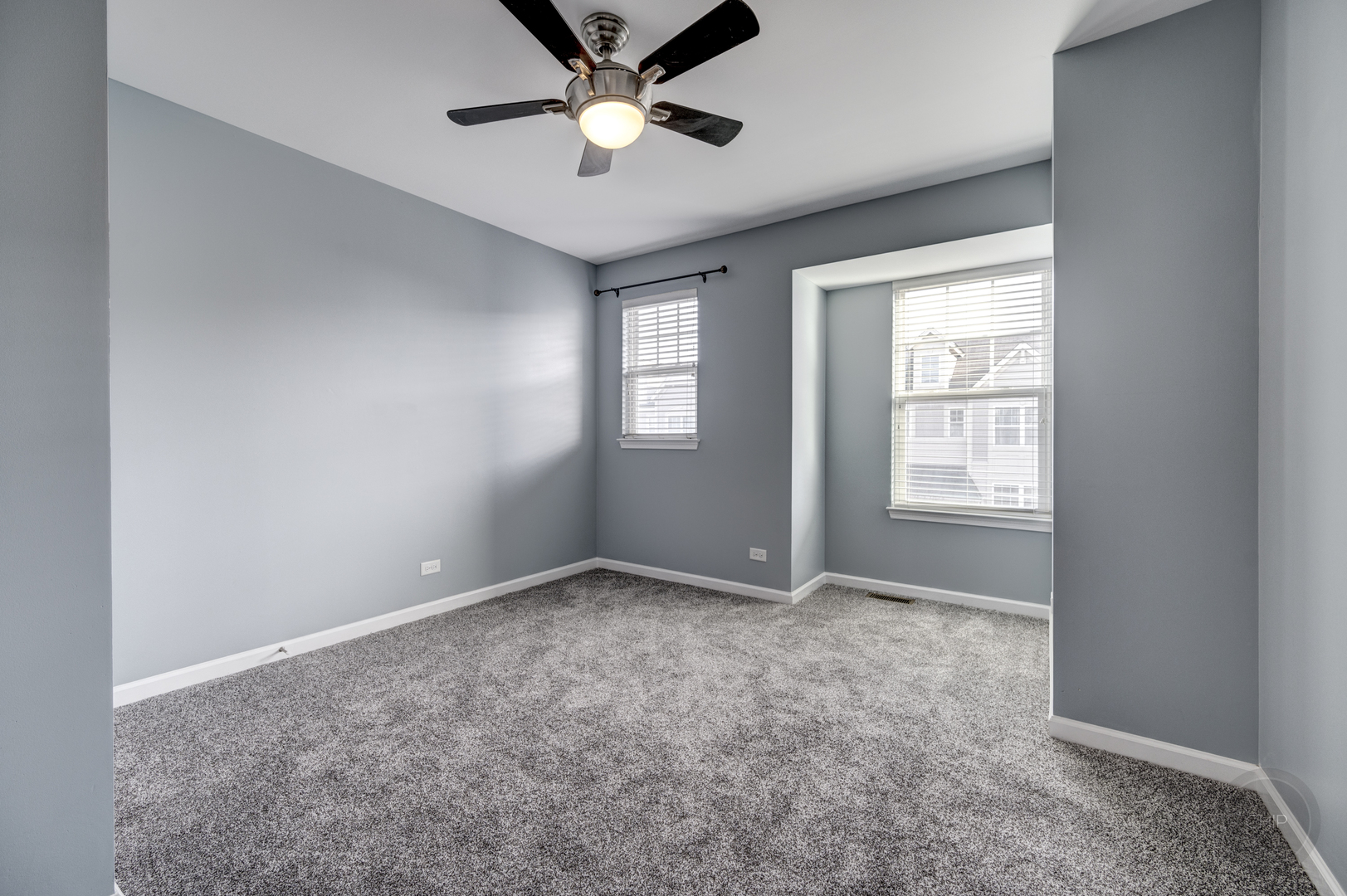 331 North Commerce Street Aurora, IL 60504 - Photo 18 of 41 an empty room with windows and fan