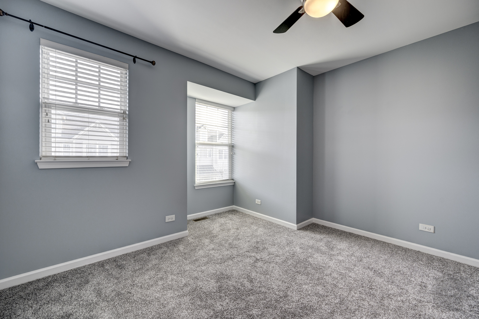 331 North Commerce Street Aurora, IL 60504 - Photo 19 of 41 an empty room with chandelier fan and windows