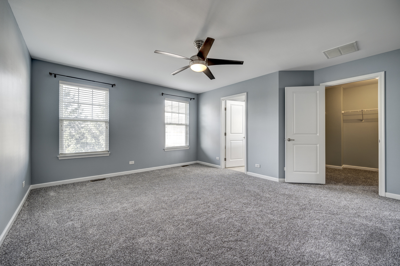 331 North Commerce Street Aurora, IL 60504 - Photo 28 of 41 an empty room with windows and fan