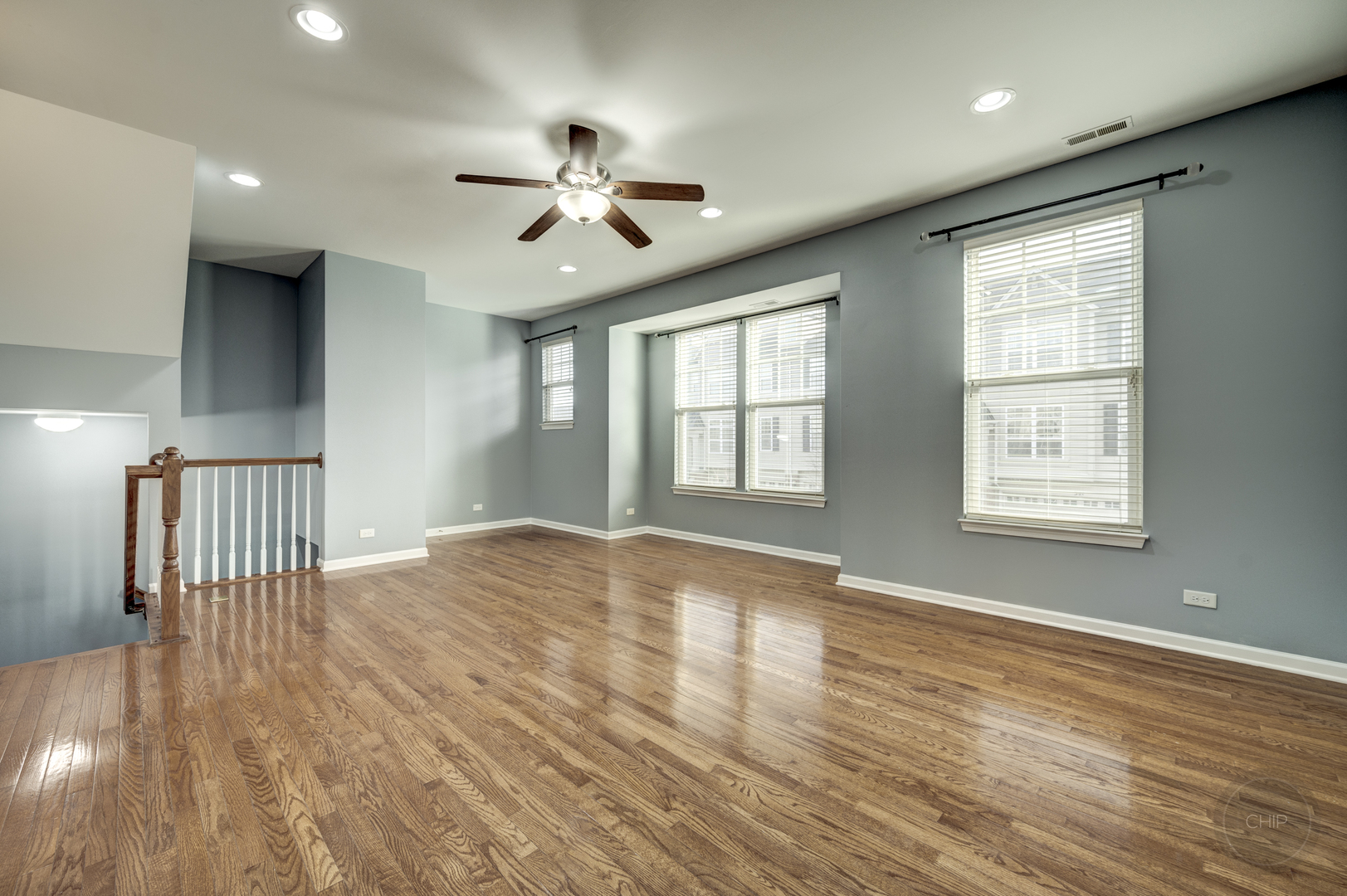 331 North Commerce Street Aurora, IL 60504 - Photo 5 of 41 a view of an empty room with wooden floor and a window