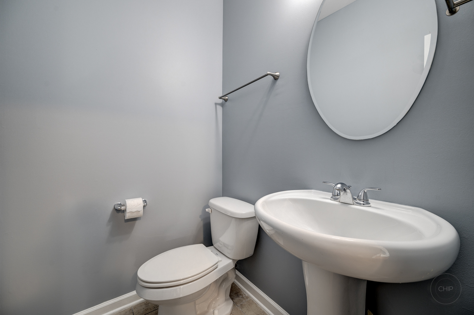 331 North Commerce Street Aurora, IL 60504 - Photo 7 of 41 a bathroom with a sink a mirror and a toilet